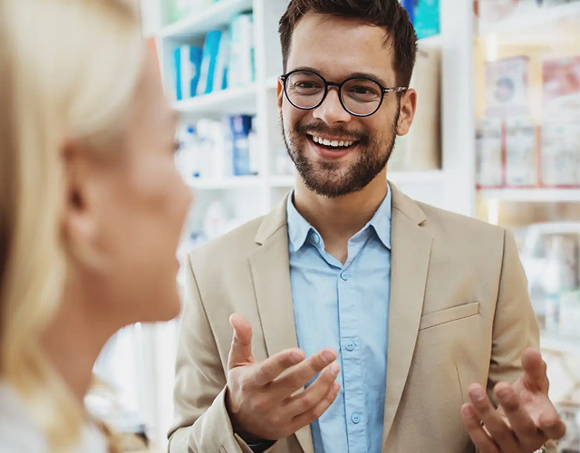 Man discussing pharmacy delivery needs with a medical professional.
