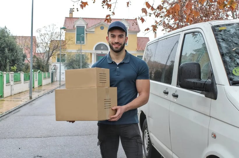 delivery man holding boxes