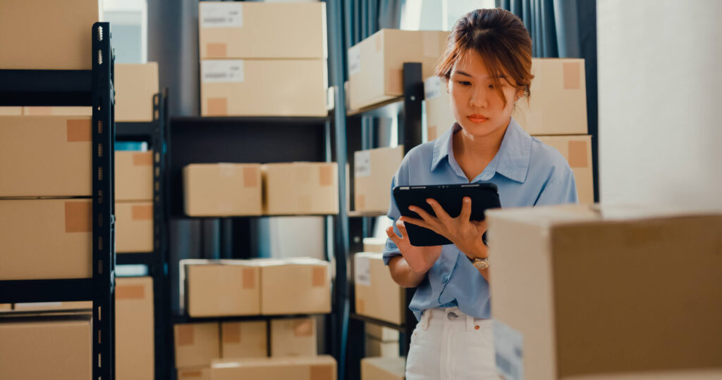 A courier delivers a pharmaceutical package to a customer.